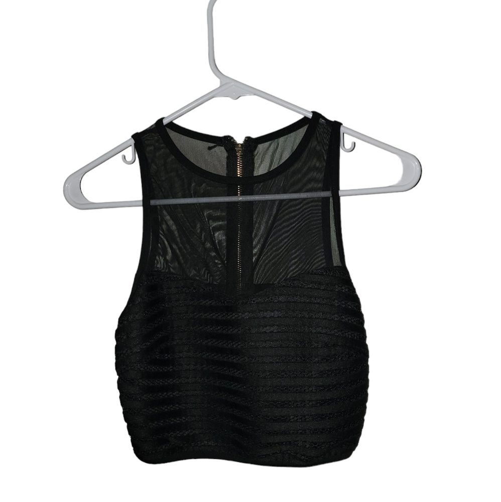 Halter neck top In Black. Size small. Gold back zipper.